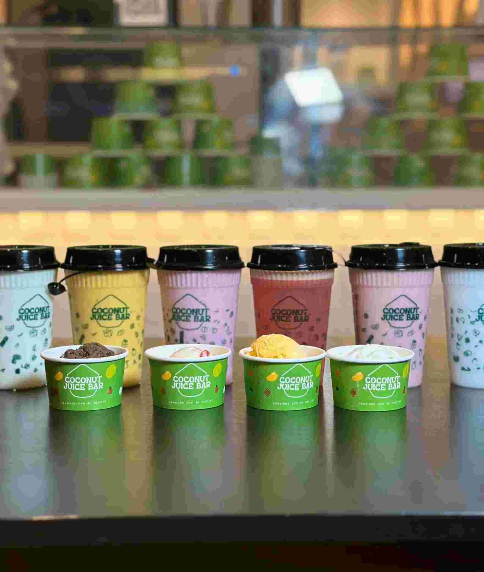 Colorful coconut juice drinks and ice cream cups display